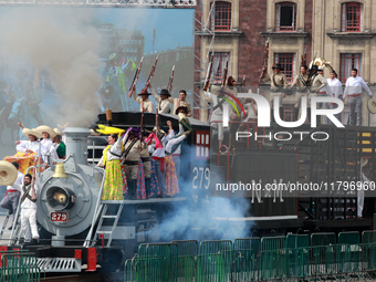 Members of the armed forces, dressed in attire from the time of the Mexican Revolution, stage a scene from the Mexican Revolution on a repli...