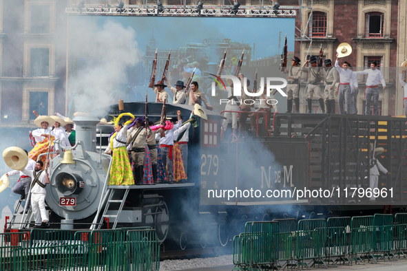 Members of the armed forces, dressed in attire from the time of the Mexican Revolution, stage a scene from the Mexican Revolution on a repli...