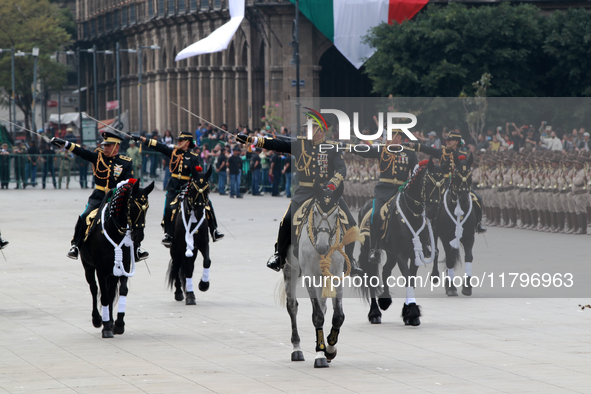 Members of the Mexican armed forces, mounted on horses, take part in the parade marking the 114th anniversary of the Mexican Revolution at t...