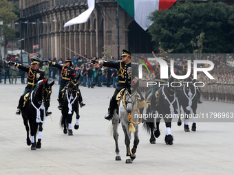 Members of the Mexican armed forces, mounted on horses, take part in the parade marking the 114th anniversary of the Mexican Revolution at t...