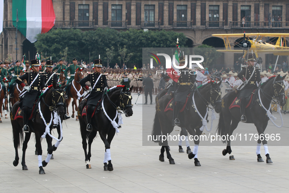 Members of the Mexican armed forces, mounted on horses, take part in the parade marking the 114th anniversary of the Mexican Revolution at t...