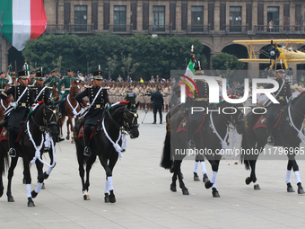 Members of the Mexican armed forces, mounted on horses, take part in the parade marking the 114th anniversary of the Mexican Revolution at t...