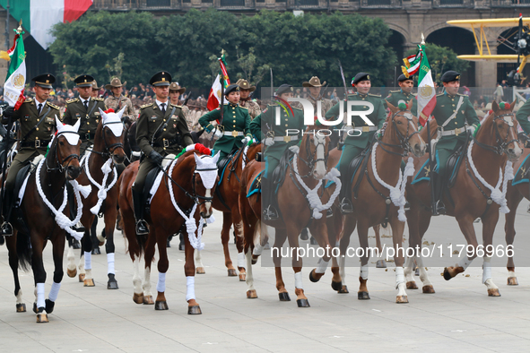 Members of the Mexican armed forces, mounted on horses, take part in the parade marking the 114th anniversary of the Mexican Revolution at t...