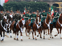 Members of the Mexican armed forces, mounted on horses, take part in the parade marking the 114th anniversary of the Mexican Revolution at t...