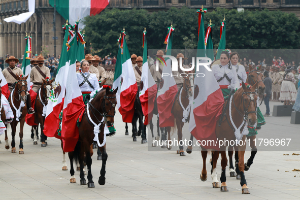 Members of the Mexican armed forces, mounted on horses, take part in the parade marking the 114th anniversary of the Mexican Revolution at t...