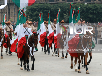 Members of the Mexican armed forces, mounted on horses, take part in the parade marking the 114th anniversary of the Mexican Revolution at t...