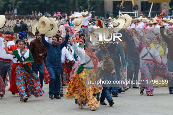 Members of the Mexican armed forces dress as they were during the Mexican Revolution and take part in a parade marking the 114th anniversary...