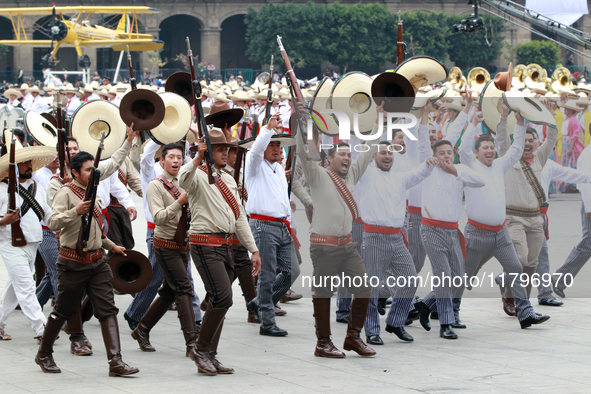 Members of the Mexican armed forces dress as they were during the Mexican Revolution and take part in a parade marking the 114th anniversary...