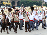 Members of the Mexican armed forces dress as they were during the Mexican Revolution and take part in a parade marking the 114th anniversary...