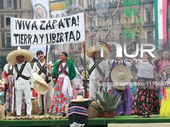 Members of the Mexican armed forces dress as they were during the Mexican Revolution and take part in a parade marking the 114th anniversary...