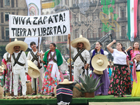 Members of the Mexican armed forces dress as they were during the Mexican Revolution and take part in a parade marking the 114th anniversary...