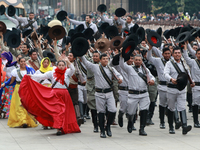 Members of the Mexican armed forces dress as they were during the Mexican Revolution and take part in a parade marking the 114th anniversary...