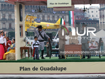 Members of the Mexican armed forces, dressed in attire from the time of the Mexican Revolution, represent a scene from the Mexican Revolutio...