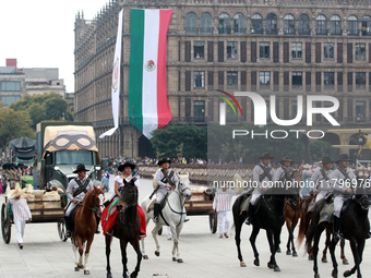 Members of the Mexican armed forces, mounted on horses, take part in the parade marking the 114th anniversary of the Mexican Revolution at t...