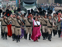 Members of the Mexican armed forces dress as they were during the Mexican Revolution and take part in a parade marking the 114th anniversary...