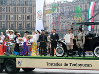 Members of the Mexican armed forces, dressed in attire from the time of the Mexican Revolution, represent a scene from the Mexican Revolutio...