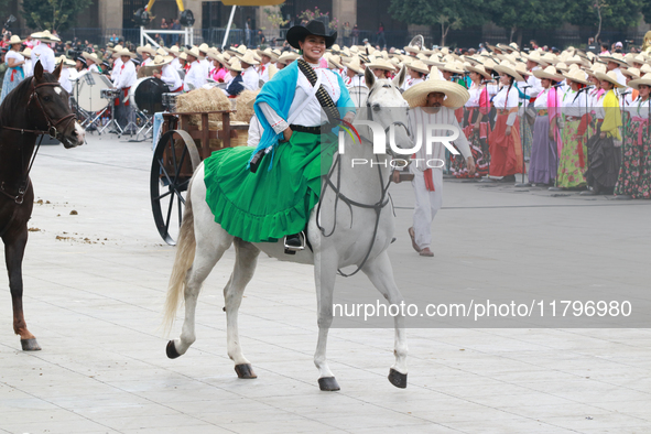 A woman dressed as a Mexican Revolutionary woman rides a horse during the parade marking the 114th anniversary of the Mexican Revolution at...