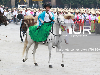 A woman dressed as a Mexican Revolutionary woman rides a horse during the parade marking the 114th anniversary of the Mexican Revolution at...