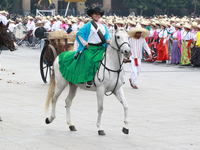 A woman dressed as a Mexican Revolutionary woman rides a horse during the parade marking the 114th anniversary of the Mexican Revolution at...