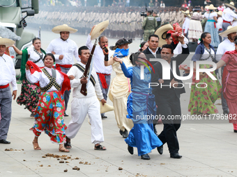 Members of the Mexican armed forces dress as they were during the Mexican Revolution and take part in a parade marking the 114th anniversary...