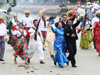 Members of the Mexican armed forces dress as they were during the Mexican Revolution and take part in a parade marking the 114th anniversary...