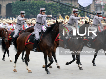 Members of the Mexican armed forces, mounted on horses, take part in the parade marking the 114th anniversary of the Mexican Revolution at t...