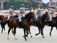 Members of the Mexican armed forces, mounted on horses, take part in the parade marking the 114th anniversary of the Mexican Revolution at t...