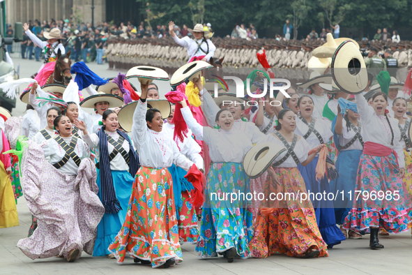 Women dressed as they were during the Mexican Revolution take part in a parade marking the 114th anniversary of the Mexican Revolution in Me...