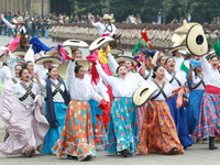 Women dressed as they were during the Mexican Revolution take part in a parade marking the 114th anniversary of the Mexican Revolution in Me...