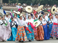 Women dressed as they were during the Mexican Revolution take part in a parade marking the 114th anniversary of the Mexican Revolution in Me...