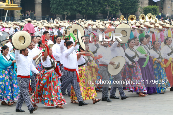 Members of the Mexican armed forces dress as they were during the Mexican Revolution and take part in a parade marking the 114th anniversary...