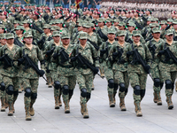 Women belonging to the Mexican Army participate in the parade on the occasion of the 114th anniversary of the Mexican Revolution at the capi...