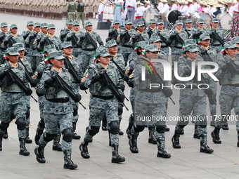 Women belonging to the National Guard participate in the parade on the occasion of the 114th anniversary of the Mexican Revolution at the Zo...