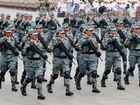 Women belonging to the National Guard participate in the parade on the occasion of the 114th anniversary of the Mexican Revolution at the Zo...