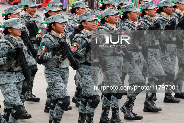 Women belonging to the National Guard participate in the parade on the occasion of the 114th anniversary of the Mexican Revolution at the Zo...