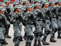 Women belonging to the National Guard participate in the parade on the occasion of the 114th anniversary of the Mexican Revolution at the Zo...