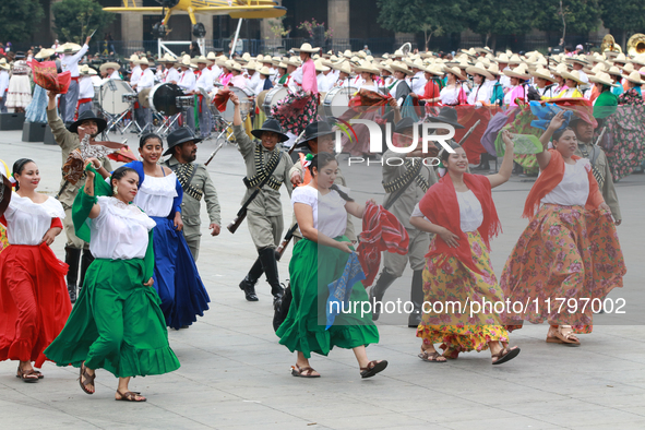 Members of the Mexican armed forces dress as they were during the Mexican Revolution and take part in a parade marking the 114th anniversary...