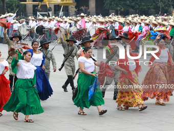 Members of the Mexican armed forces dress as they were during the Mexican Revolution and take part in a parade marking the 114th anniversary...