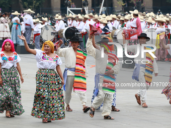 Members of the Mexican armed forces dress as they were during the Mexican Revolution and take part in a parade marking the 114th anniversary...