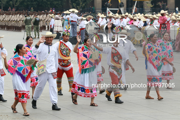 Members of the Mexican armed forces dress as they were during the Mexican Revolution and take part in a parade marking the 114th anniversary...