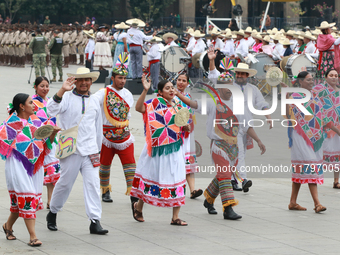 Members of the Mexican armed forces dress as they were during the Mexican Revolution and take part in a parade marking the 114th anniversary...