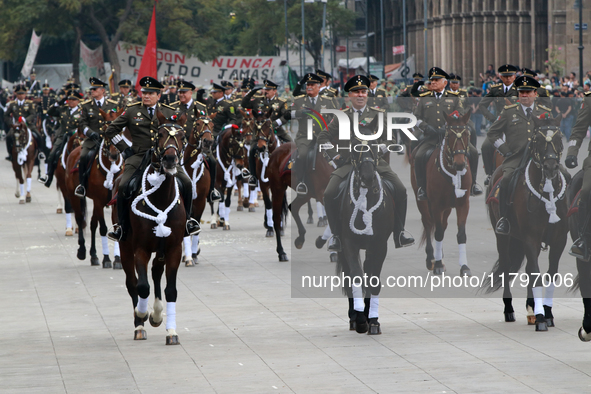 Members of the Mexican armed forces, mounted on horses, take part in the parade marking the 114th anniversary of the Mexican Revolution at t...