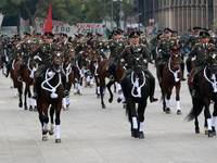 Members of the Mexican armed forces, mounted on horses, take part in the parade marking the 114th anniversary of the Mexican Revolution at t...