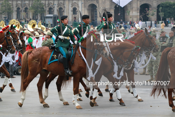 Members of the Mexican armed forces, mounted on horses, take part in the parade marking the 114th anniversary of the Mexican Revolution at t...