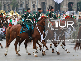 Members of the Mexican armed forces, mounted on horses, take part in the parade marking the 114th anniversary of the Mexican Revolution at t...