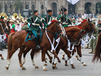 Members of the Mexican armed forces, mounted on horses, take part in the parade marking the 114th anniversary of the Mexican Revolution at t...