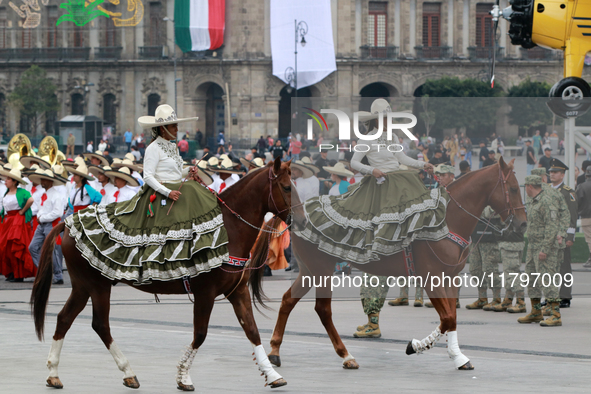 Charro women ride horses during the parade for the 114th anniversary of the Mexican Revolution at the Zocalo capital, in Mexico City, Mexico...