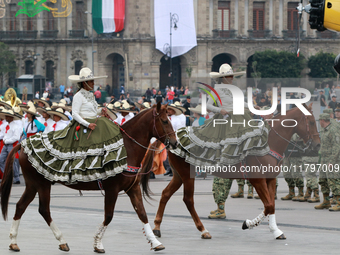 Charro women ride horses during the parade for the 114th anniversary of the Mexican Revolution at the Zocalo capital, in Mexico City, Mexico...