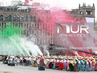 Confetti in the colors of the Mexican flag (green, white, and red) is thrown at the end of the parade on the occasion of the 114th anniversa...