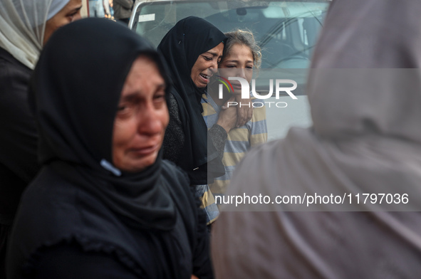 Mourners react during the funeral of Palestinians killed in an Israeli strike at Al-Aqsa Martyrs Hospital in Deir Al-Balah, in the central G...